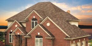 Large mansion home with shingle roof