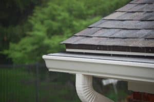 seamless gutter system installed on home with shingle roof