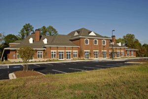 New commercial brick building with empty parking lot